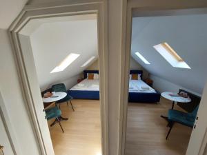 A bed or beds in a room at Palma Vendégház