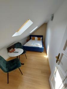 A bed or beds in a room at Palma Vendégház