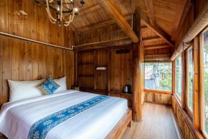 Postel nebo postele na pokoji v ubytování Legend Home Sapa