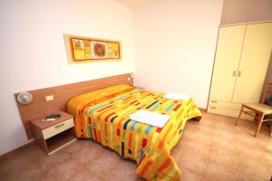 Rúm í herbergi á Hotel Alguer