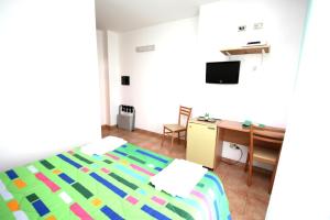 Rúm í herbergi á Hotel Alguer