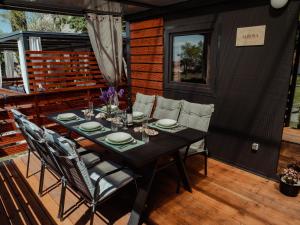 a table on the deck of a tiny house at Mobile home Aurora in Sveti Juraj