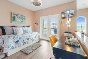 a bedroom with a bed and a desk and a table at Gratitude Island in Navarre +59 photos