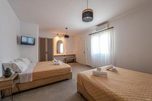 A bed or beds in a room at Katerina View