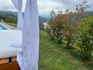a view of a bed and some bushes at Quinta de Catapeixe Douro River in Magrelos