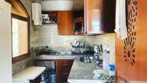 a kitchen with a sink and a counter top at قصر الصغير ديكي in Tangier