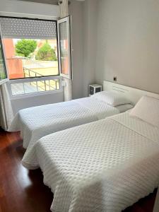Posteľ alebo postele v izbe v ubytovaní APARTAMENTO LA PICOTA