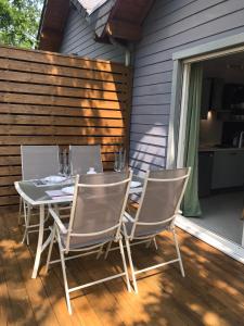 a table and chairs sitting on a patio at Eleni appart 4p à Richelieu in Chaveignes