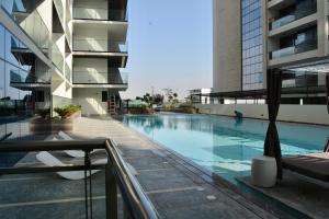 a swimming pool on the roof of a building at Luxurious Smart Home in Dubai