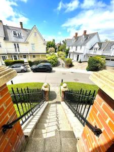 a black fence in front of a house at Luxurious 2 bed in Beaulieu Park in Broomfield