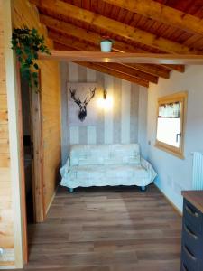 A bed or beds in a room at CHALET SIMONETTA - Locanda da Tullio