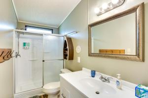 a bathroom with a shower toilet and a sink at Hot Tub and Dock Lakefront Mabank Home in Mabank +29 photos