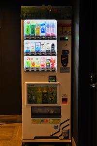 a refrigerator filled with lots of drinks at FL Hotel Dotonbori in Osaka