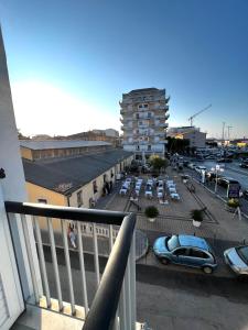 a balcony of a building with a parking lot at Comfort Rooms Vinum in Civitanova Marche