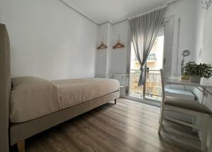 Postel nebo postele na pokoji v ubytování Slow Room Valencia