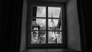 a window with a view of a city at Guade Stub´n in Garmisch-Partenkirchen