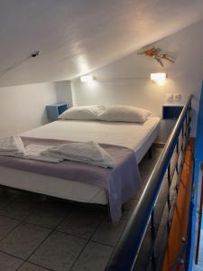 Posteľ alebo postele v izbe v ubytovaní Coastal Apartments Volos Alykes