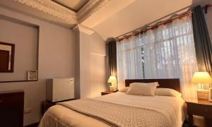Postel nebo postele na pokoji v ubytování El Balcon Hostal Turistico