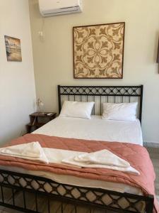 Posteľ alebo postele v izbe v ubytovaní Coastal Apartments Volos Alykes