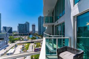 a balcony of a building with a view of a city at Elegant king bedroom Loft in Miami