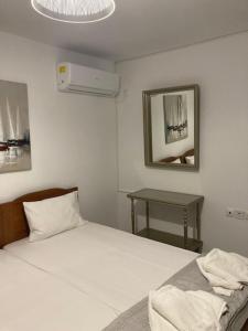 Posteľ alebo postele v izbe v ubytovaní Coastal Apartments Volos Alykes