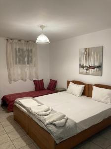 Posteľ alebo postele v izbe v ubytovaní Coastal Apartments Volos Alykes