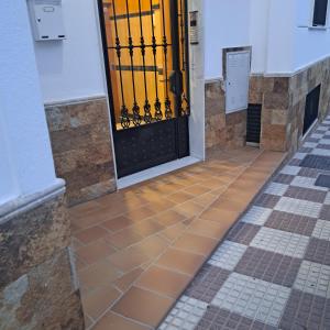 a door in a building with a tile floor at Apartamento Maite Jiménez in Alhaurín el Grande