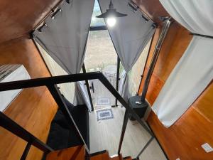 a view from the inside of a tent with two windows at Chalé Roma Negra in Morro do Chapéu