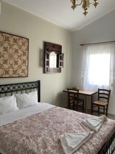 Posteľ alebo postele v izbe v ubytovaní Coastal Apartments Volos Alykes