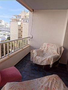 a balcony with two beds and a balcony with a view at beach house in Marbella