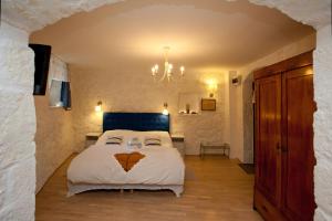 a bedroom with a bed with a face drawn on it at Bed & Breakfast Vila Baguc in Split
