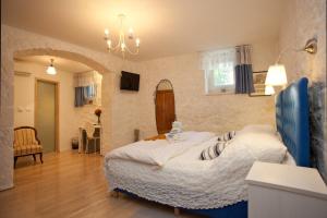 a bedroom with a large bed in a room at Bed & Breakfast Vila Baguc in Split