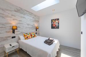 Ένα ή περισσότερα κρεβάτια σε δωμάτιο στο La Casita de Hugo
