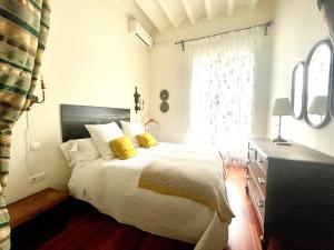 Ein Bett oder Betten in einem Zimmer der Unterkunft Eva Recommends Porvenir Apartment