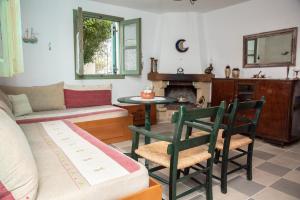 a living room with a couch and a table at Kos Gaia Garden House 