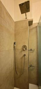 a shower with a glass door in a bathroom at Casa del Mare- Bluchalet in Rapallo