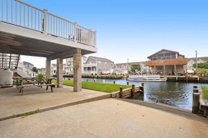 a dock with a marina with a boat in the water at Edgewater Acres --- 39167 Garfield Avenue in Selbyville