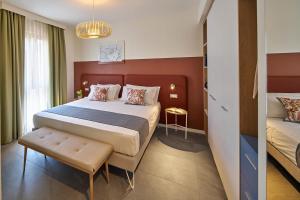 Ένα ή περισσότερα κρεβάτια σε δωμάτιο στο Leti Apartments Garda +32 φωτογραφίες