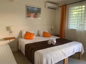 Hôtel DOUCE VAGUE客房内的一张或多张床位