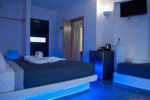 Postelja oz. postelje v sobi nastanitve Sun Springs Suites