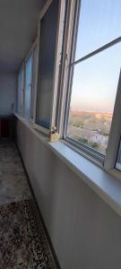 an empty window sill in a room with a view at Апартаменты в центре города in Aktobe