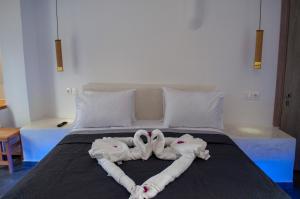 Postelja oz. postelje v sobi nastanitve Sun Springs Suites