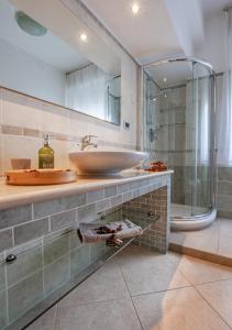 a bathroom with a sink and a shower at Luxury House near train station in Livorno