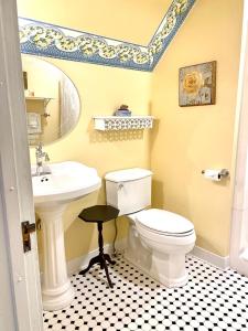 a bathroom with a white toilet and a sink at The Ginkgo Tree in Mount Pleasant +70 photos