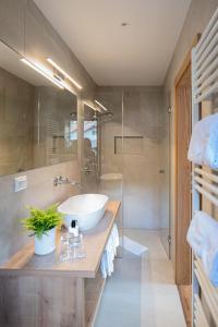 Vannituba majutusasutuses Garni Hotel Am Meilenstein