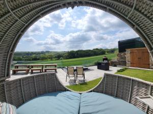 a circular view of a patio with a table and chairs at Top Hill Farm Cottage in Sheffield