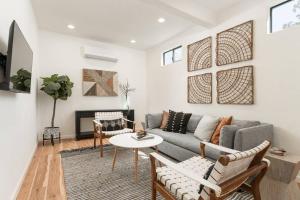 a living room with a couch and a table at 1 Bedroom Casita - Casa Blanca in Montecito