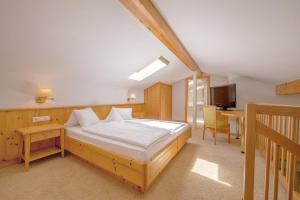 Voodi või voodid majutusasutuse Garni Hotel Am Meilenstein toas