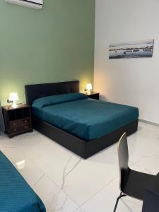 Posteľ alebo postele v izbe v ubytovaní Dante Rooms