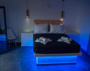 Postelja oz. postelje v sobi nastanitve Sun Springs Suites